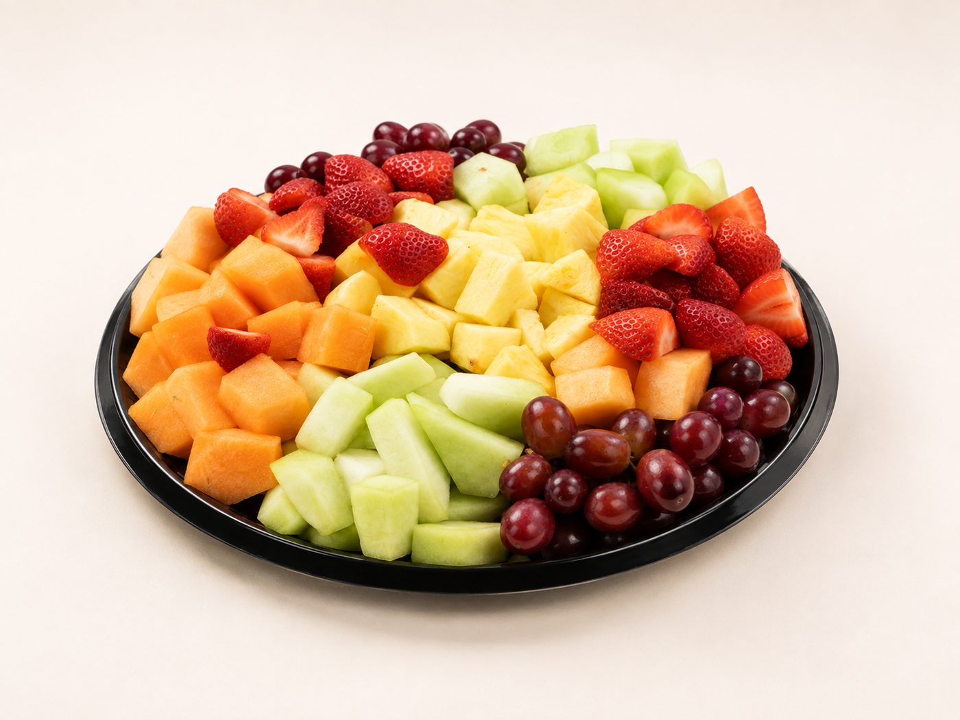 Fresh fruit platter with sliced seasonal fruit