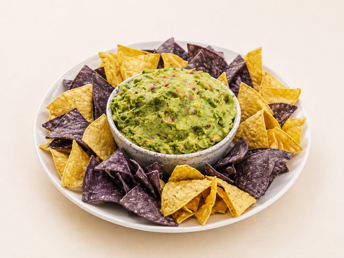 Fresh guacamole and tortilla chips tray