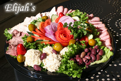 Deli meat and cheese platter with side salads