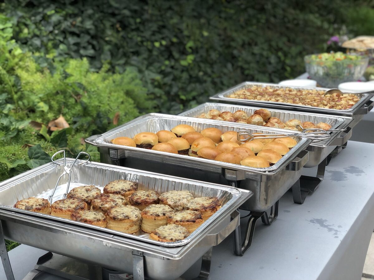 Office lunch buffet with deli platters and salads
